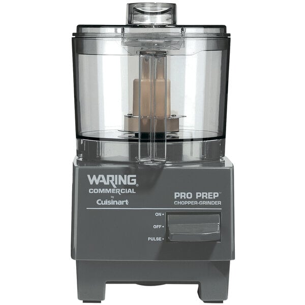 A close-up of a Waring Pro Prep food processor with a chopper grinder attachment.