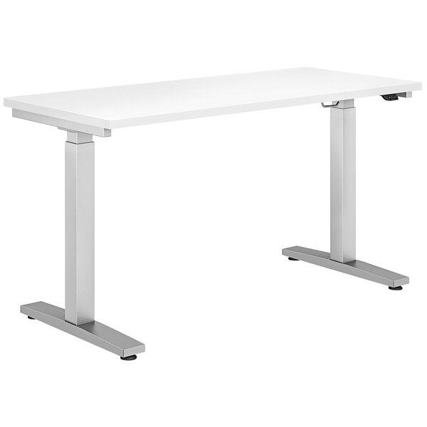 A white rectangular HON Coze height-adjustable desk with metal legs.