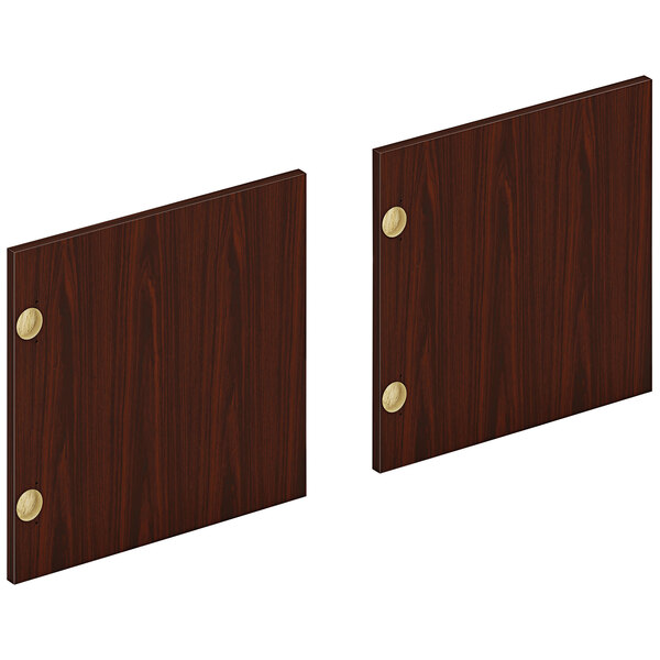 Two mahogany laminate doors with brass hardware.