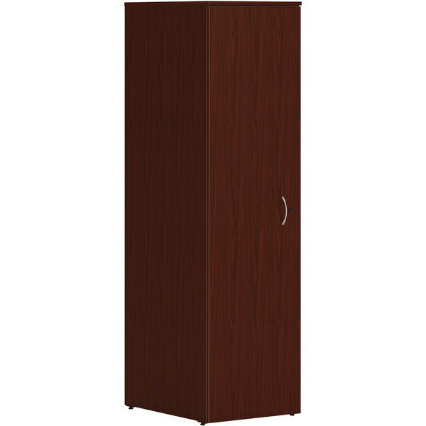 A traditional mahogany HON wardrobe cabinet with a silver handle.