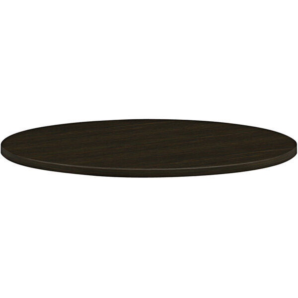 A HON round Java oak laminate table top.