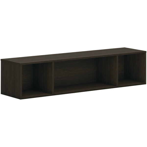 A dark brown HON wall mounted open storage cabinet with three shelves.