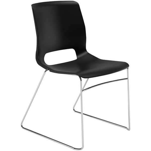 A 4 pack of black plastic HON Motivate stacking chairs with chrome legs.