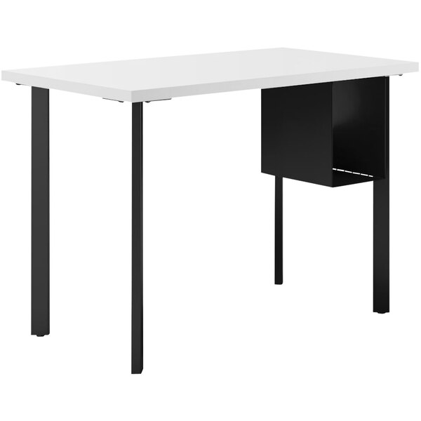 A white rectangular HON desk with black trim and a U-shaped shelf.
