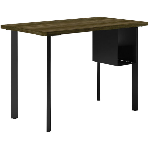 A HON Florence Walnut laminate desk with black U-storage shelves and black legs.
