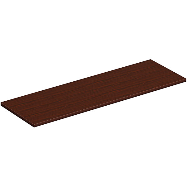 A rectangular wooden surface in a traditional mahogany finish.