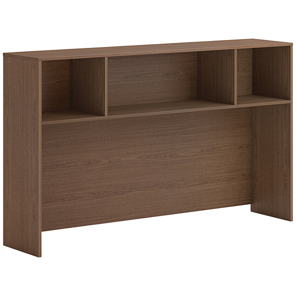A brown wooden HON open desk hutch with shelves.