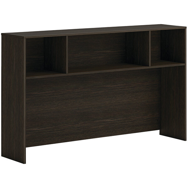 A brown HON desk hutch with shelves.