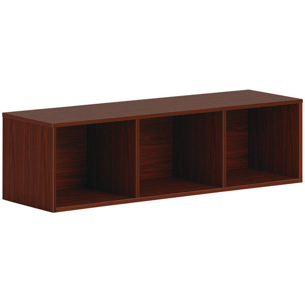 A brown wooden HON wall mounted open storage cabinet with shelves.