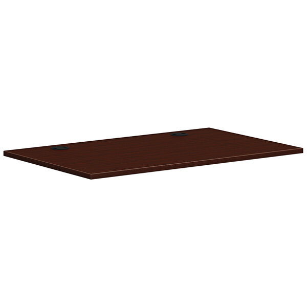 A rectangular wooden HON worksurface in traditional mahogany.
