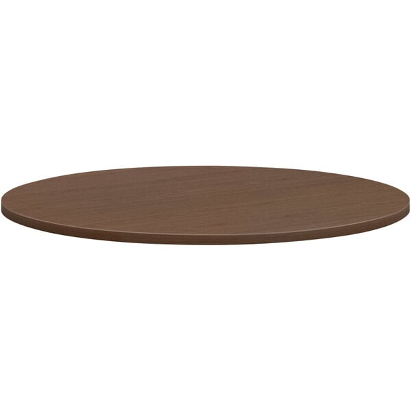A brown circular HON conference table top.