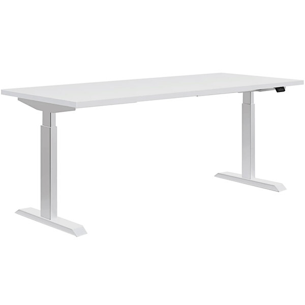 A white rectangular HON Coze height-adjustable desk with white legs.