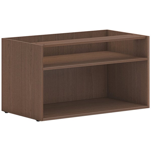 A sepia walnut HON low open storage credenza shelf with two shelves.