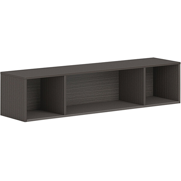 A black HON wall mounted open storage cabinet with shelves.