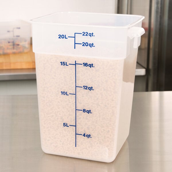 A translucent Cambro CamSquares food storage container with measurements on it.