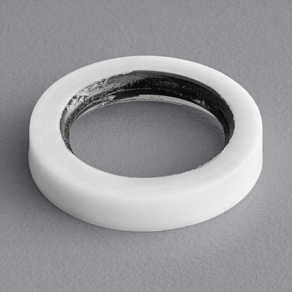 A white rubber O-ring with black and white stripes.