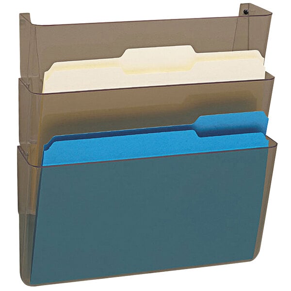A smoke-colored Deflecto wall mount with 3 clear pockets containing blue and white files.