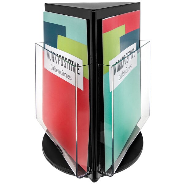 A black Deflecto 3-sided rotating countertop magazine display holding multiple magazines.