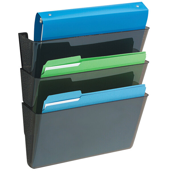 A black Deflecto wall mount with three black plastic pockets holding file folders.