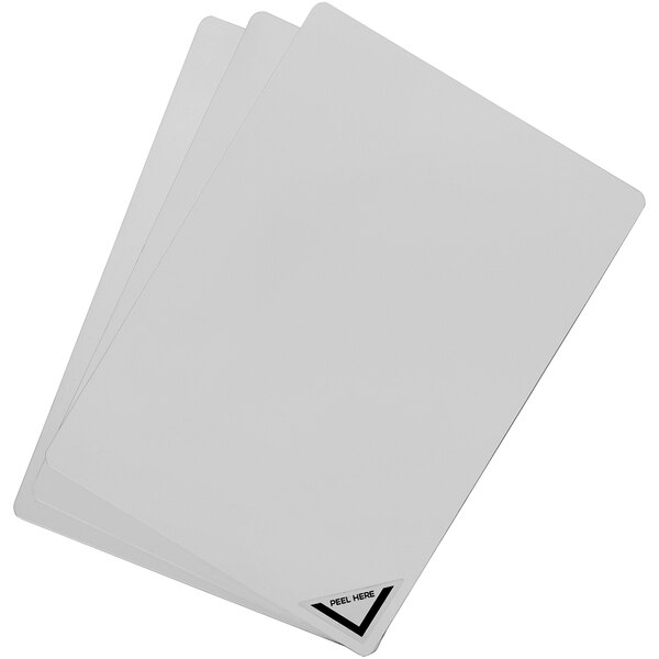 A stack of three white Deflecto cards with black triangles on them.