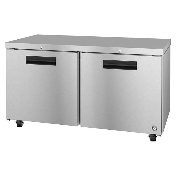 A stainless steel Hoshizaki undercounter freezer with black handles.