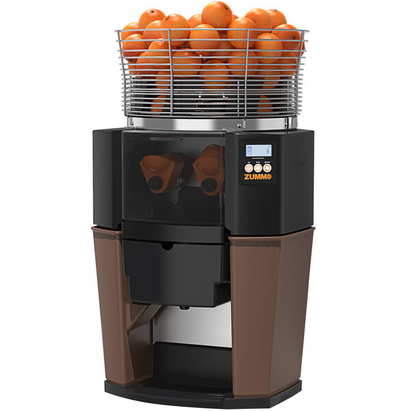 A Zummo Z14 commercial juicer with oranges inside.