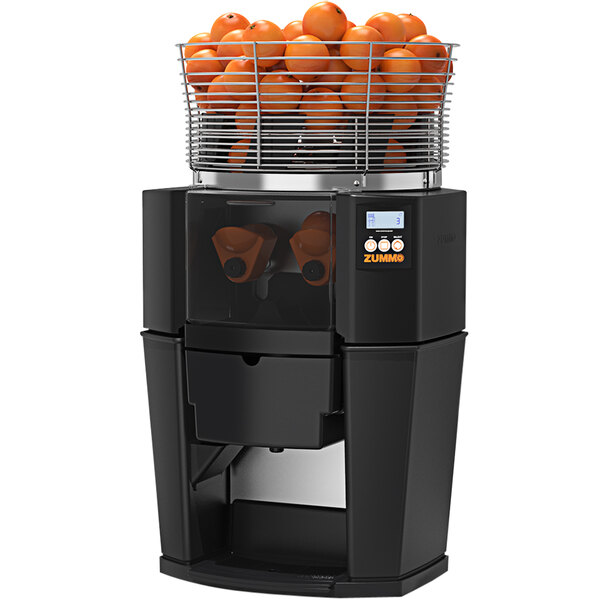 A black Zummo Z14 commercial juicer with oranges in it.