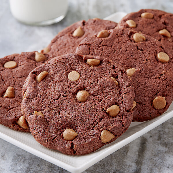 A plate of chocolate cookies with Gertrude Hawk Peanut Butter baking chips.