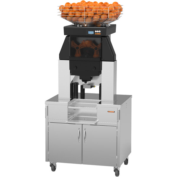 A Zummo Nature Adapt Max commercial juicer with oranges on top.