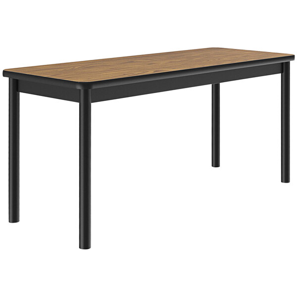 A Correll library table with black legs and a medium oak wood top.