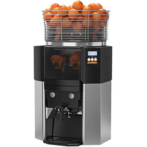 A Zummo Z14 commercial juicer with oranges in a basket.