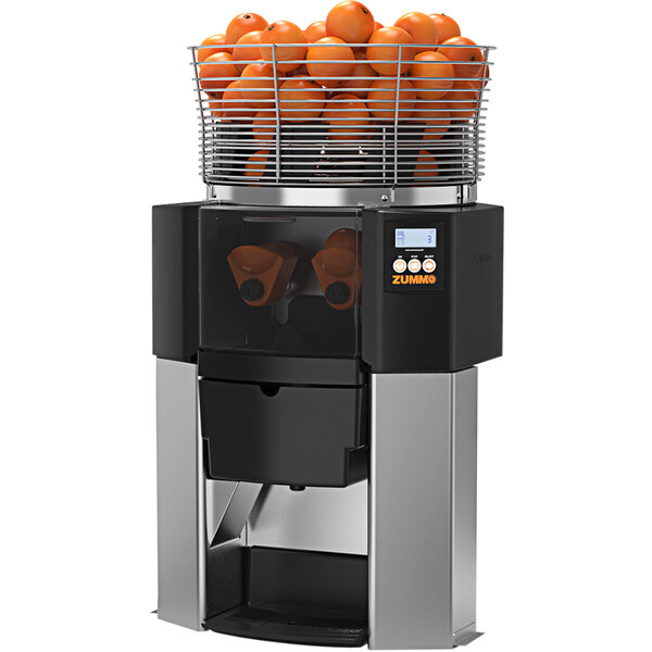 A Zummo Z14 Nature commercial juicer with oranges in it.