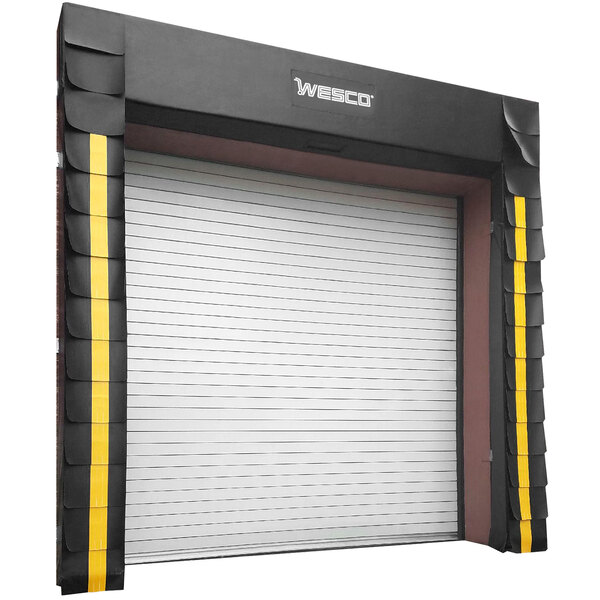 A white garage door with a black and yellow Wesco dock seal.