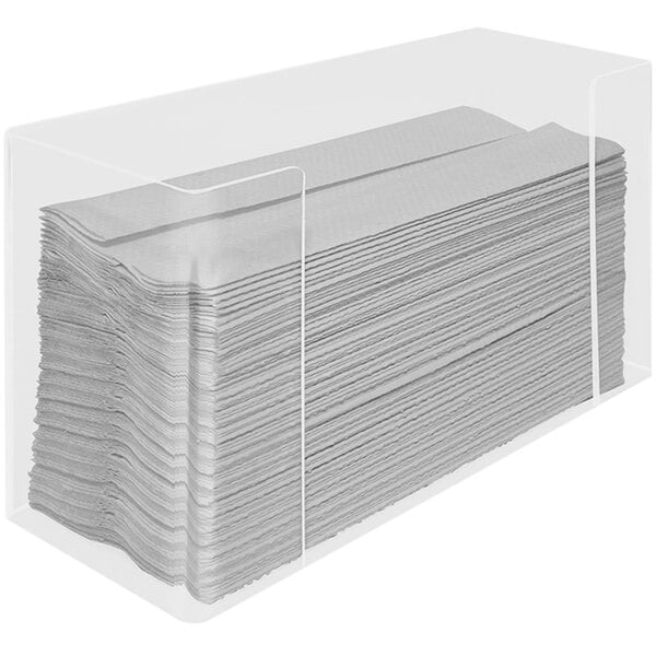 A stack of paper towels in a clear container.