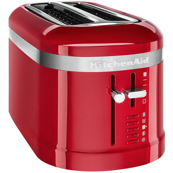 A red KitchenAid toaster with two slices of bread in the slots.