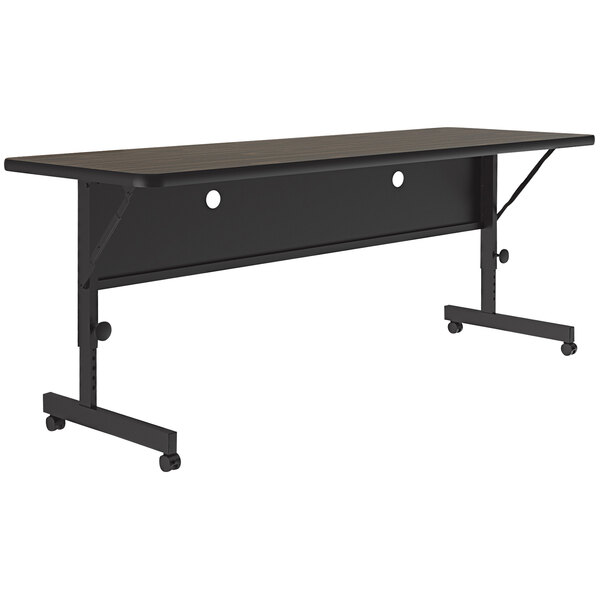 A black rectangular Correll flip top table with wheels.