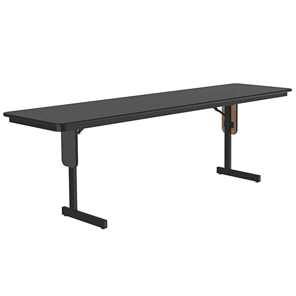 A black rectangular Correll seminar table with panel legs.