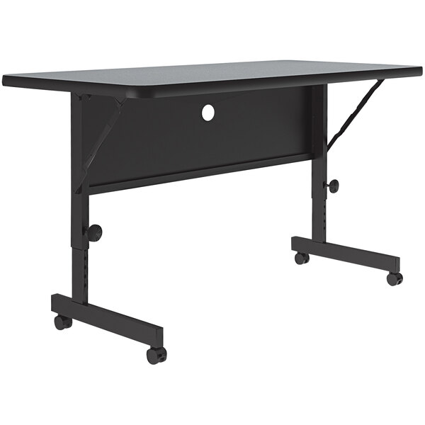 A gray rectangular Correll flip top table with adjustable height.