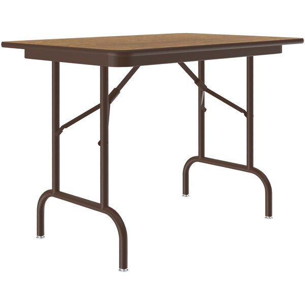 A Correll medium oak folding table with brown metal legs.