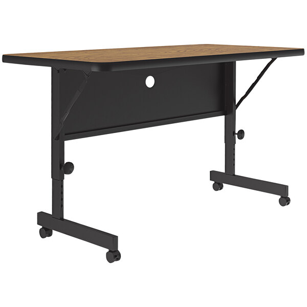 A brown Correll flip top table on wheels.