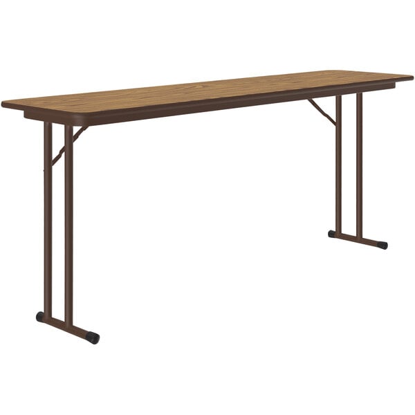 A brown rectangular Correll seminar table with black off-set legs.