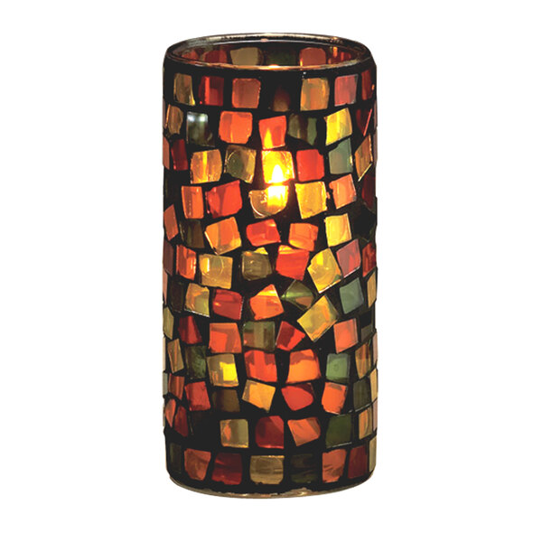 A Sterno Rioja glass candle holder with a lit candle inside.