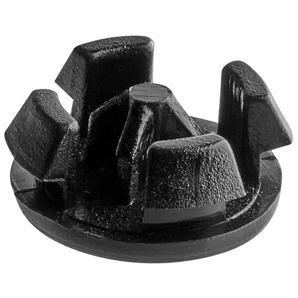 A black plastic Amana hole plug with four holes.