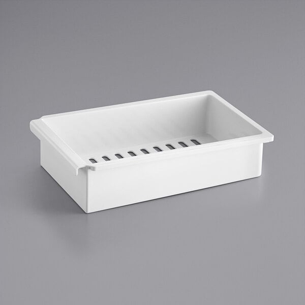 A white rectangular plastic tray with holes.