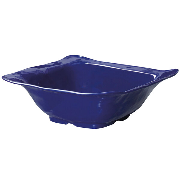 A cobalt blue square catering bowl with a white background.