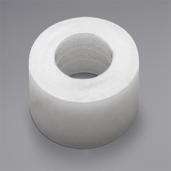 A circular white nylon spacer with a hole in it.