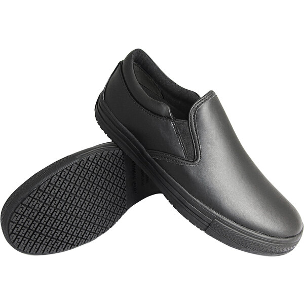 A pair of black Genuine Grip slip-on shoes with rubber soles.