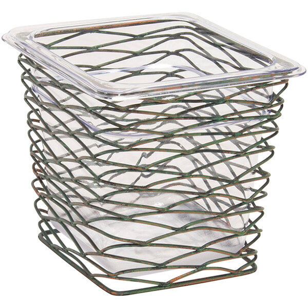 A Front of the House fused iron deep housing pan set in a wire basket with a clear lid.