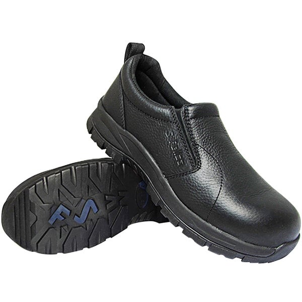 A pair of Genuine Grip black non-slip shoes with a close-up of the sole.