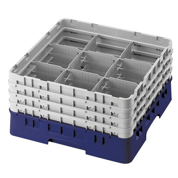 A navy blue plastic Cambro glass rack with 9 compartments and 5 extenders.